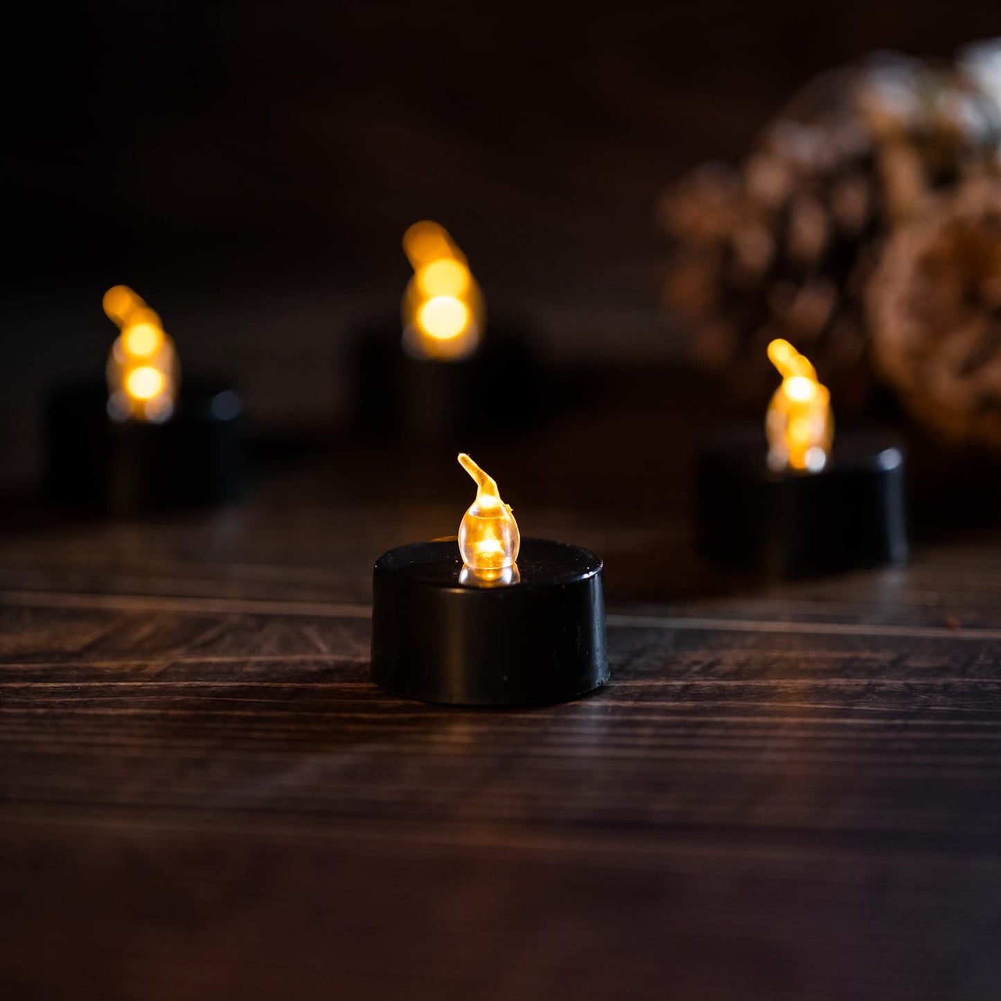 LANKER 24 Pack Black Tea Lights Candles, Flickering Warm Yellow Flameless LED Tealights, Long Lasting Battery Operated Fake Candles, Decoration for Wedding, Halloween and Christmas