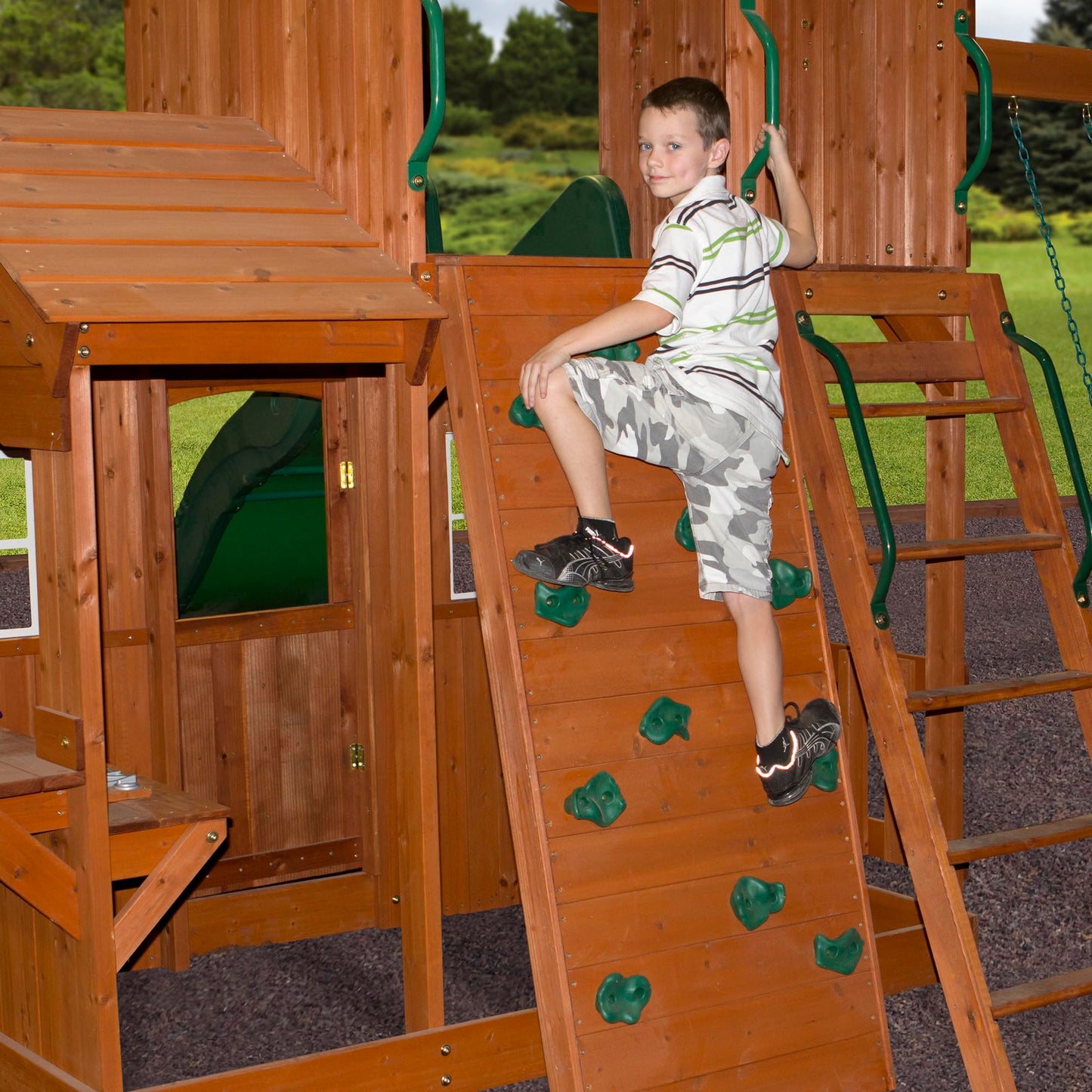 Backyard Discovery Shenandoah Cedar Wood Swing Set with Wave Slide, Raised Clubhouse, Playhouse, Play Kitchen, Belt Swings, Trapeze, Rock Wall, Ladder, Picnic Table, Full Door, Outdoor Playset